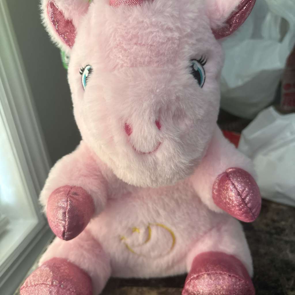 Vaca de peluche rosa con luz y musica