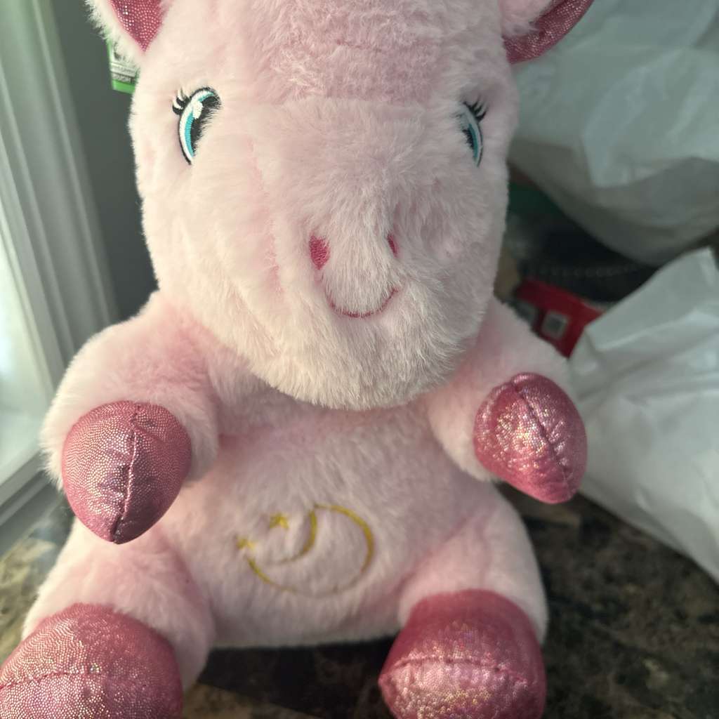 Vaca de peluche rosa con luz y musica